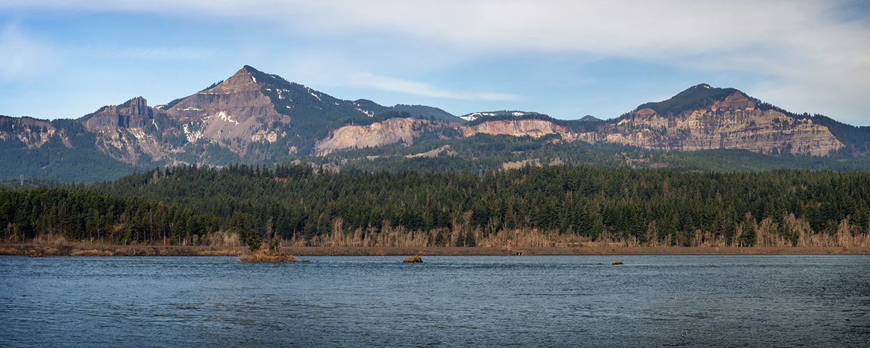 Headscarps of the Cascade landslide complex, seen from Thunder Island in Cascade Locks, Oregon. From left to right-Table Mountain, Red Bluffs, and Greenleaf Peak.